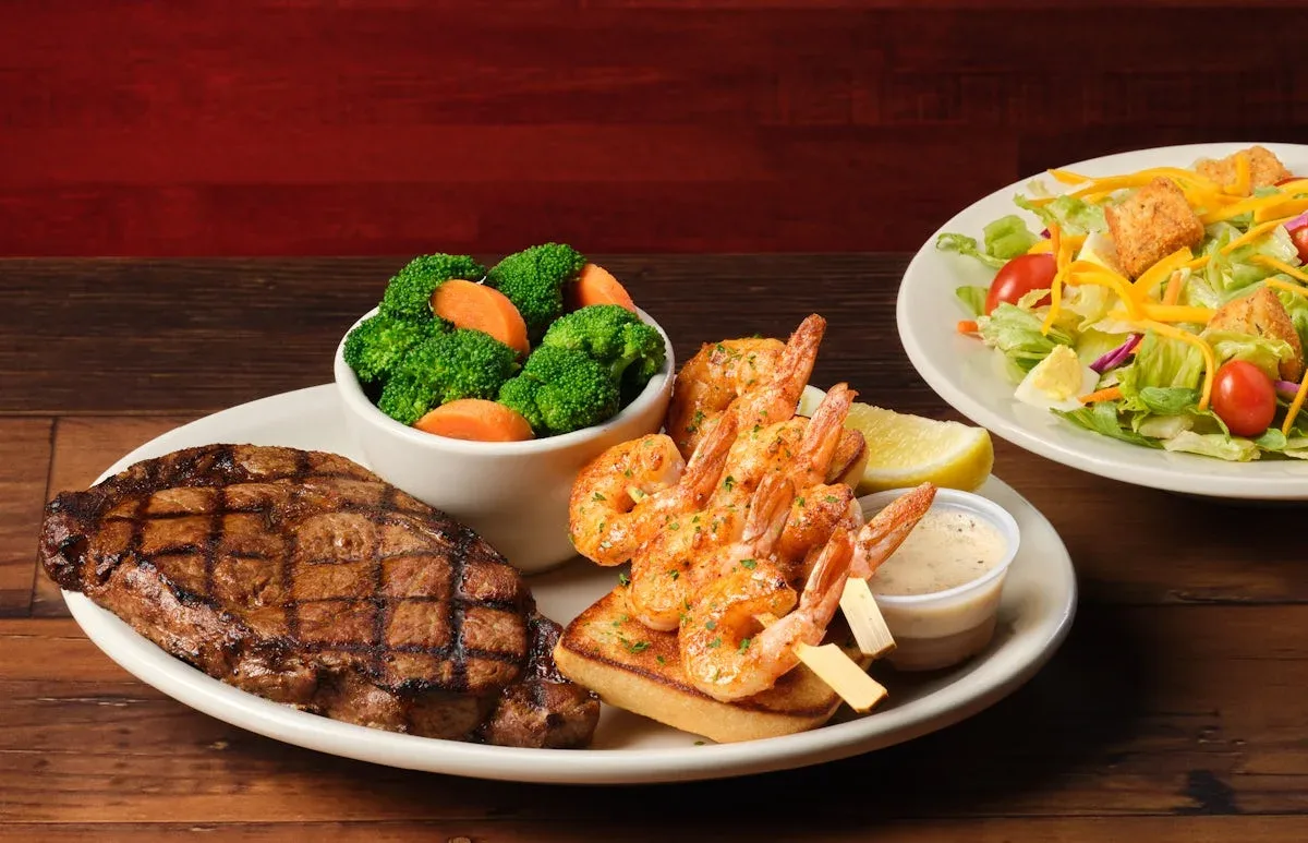 Texas Roadhouse dinner prices: ribeye and grilled shrimp plate